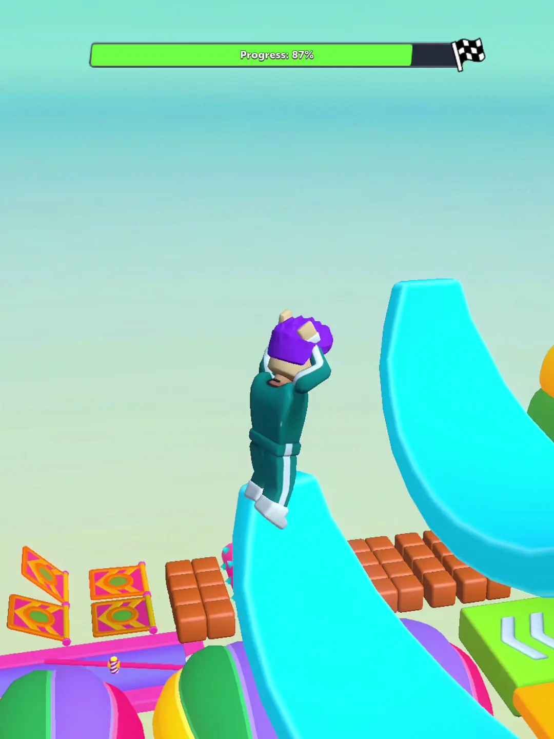 Kai's habitat margin — A player faces a large curved obstacle and colorful props above the landscape.